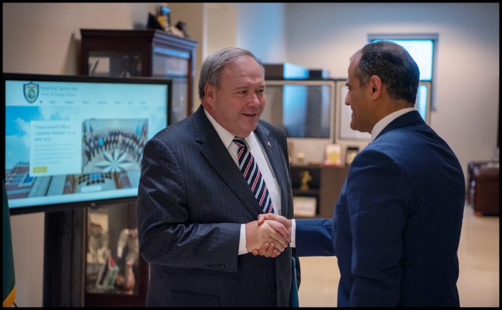 Deputy Director and Ambassador shaking hands