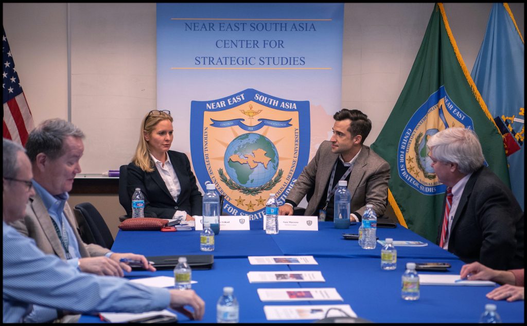 Two people at the front of a table.